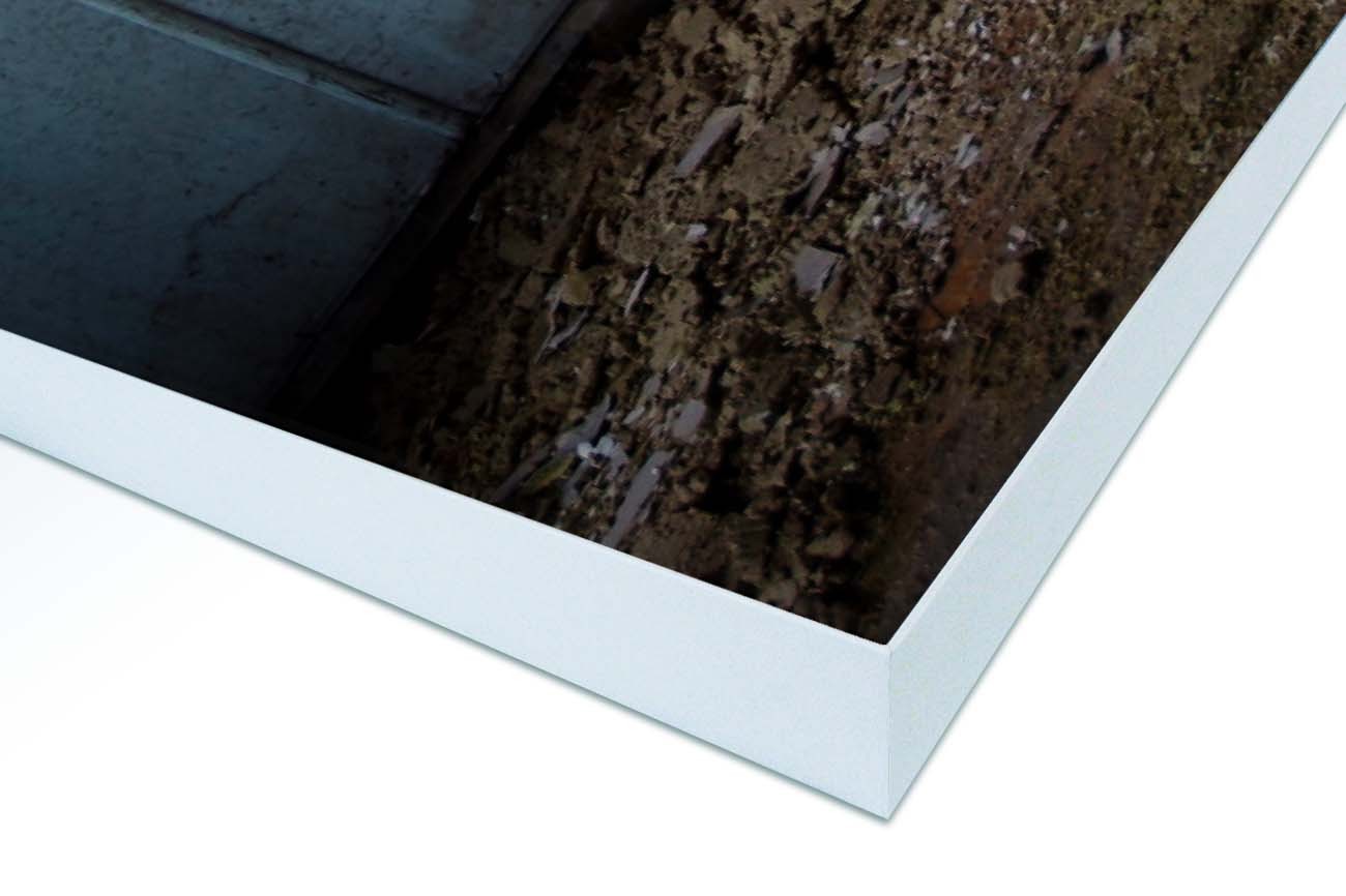 Close up textieldoek in frame gemonteerd wit